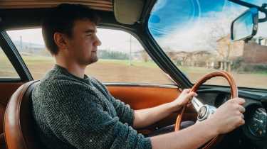 Auto Express senior news reporter Alastair Crooks driving the Lamborghini 400 GT